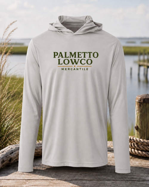 Light gray hoodie with 'Palmetto Lowco Mercantile' logo on a wooden dock with water and grass in the background
