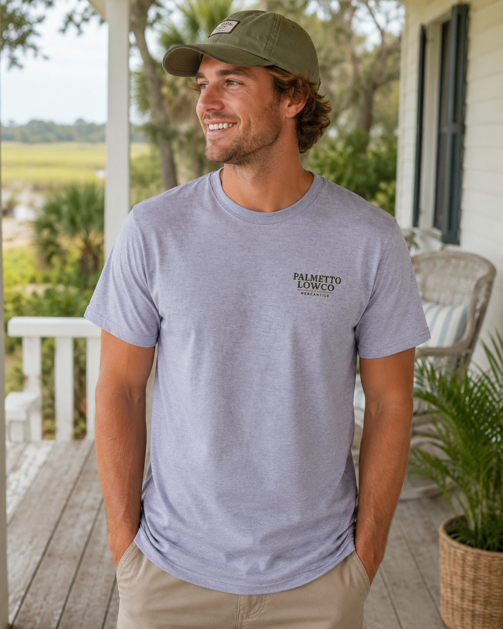 Man wearing a gray t-shirt with 'Palmetto Lowcountry' logo on a porch.