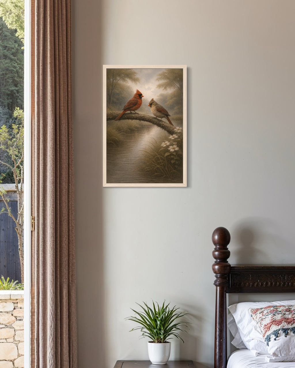 Framed artwork of two birds on a branch above a bed in a bedroom.