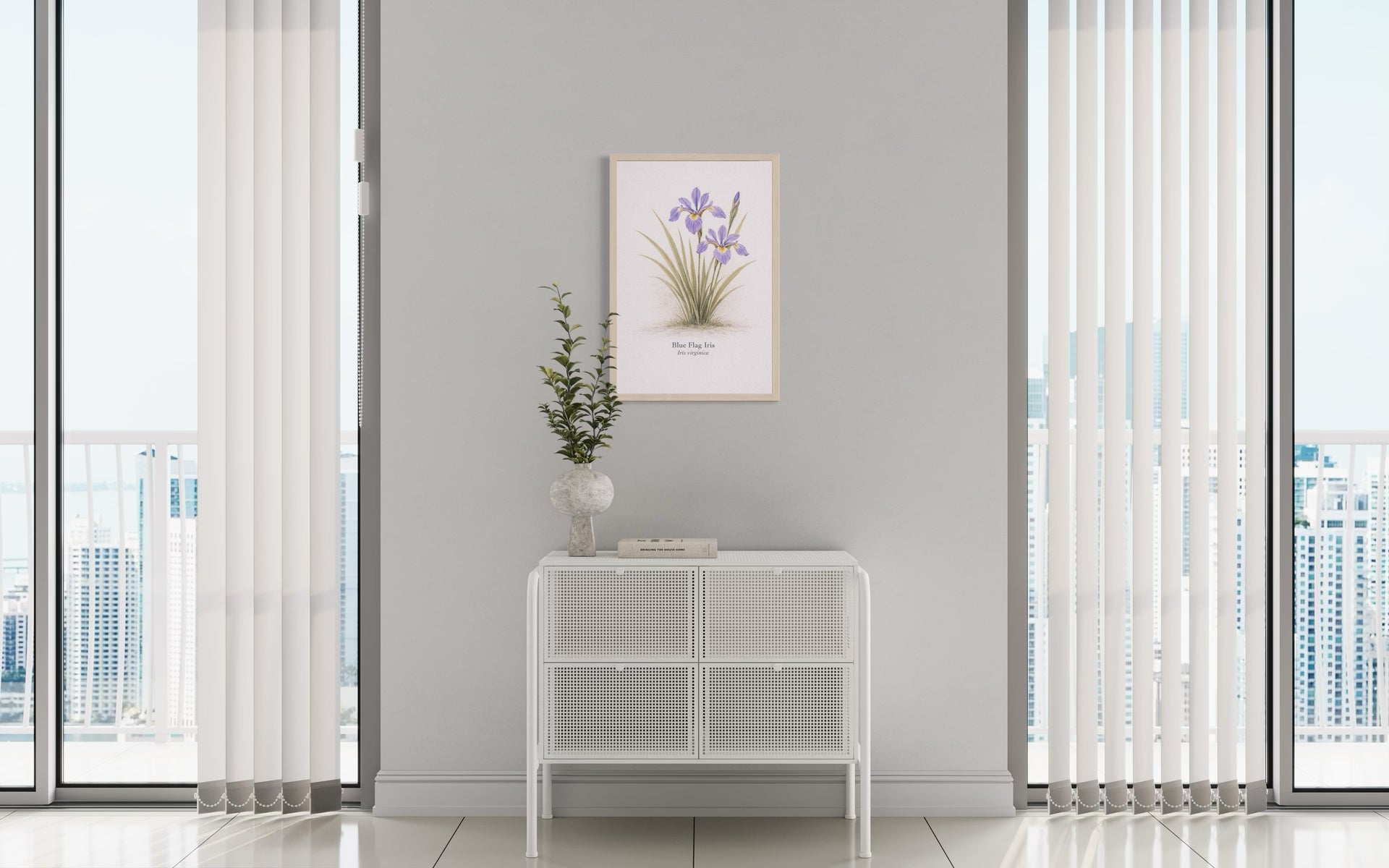 Modern interior with a side table, plant, and framed picture on a gray wall.