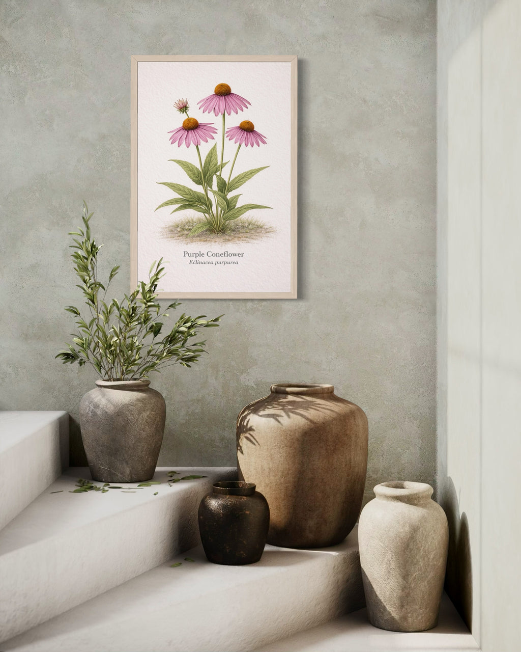 Framed botanical print of pink flowers on a wall above decorative vases.