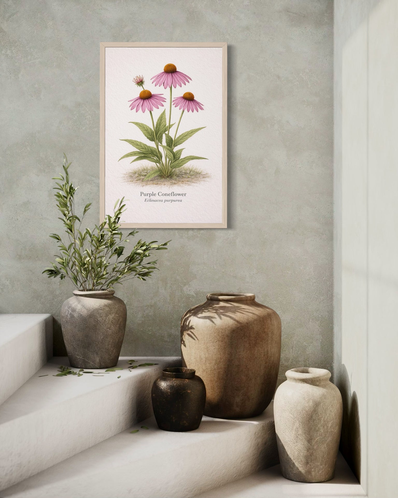 Framed botanical print of pink flowers on a wall above decorative vases.