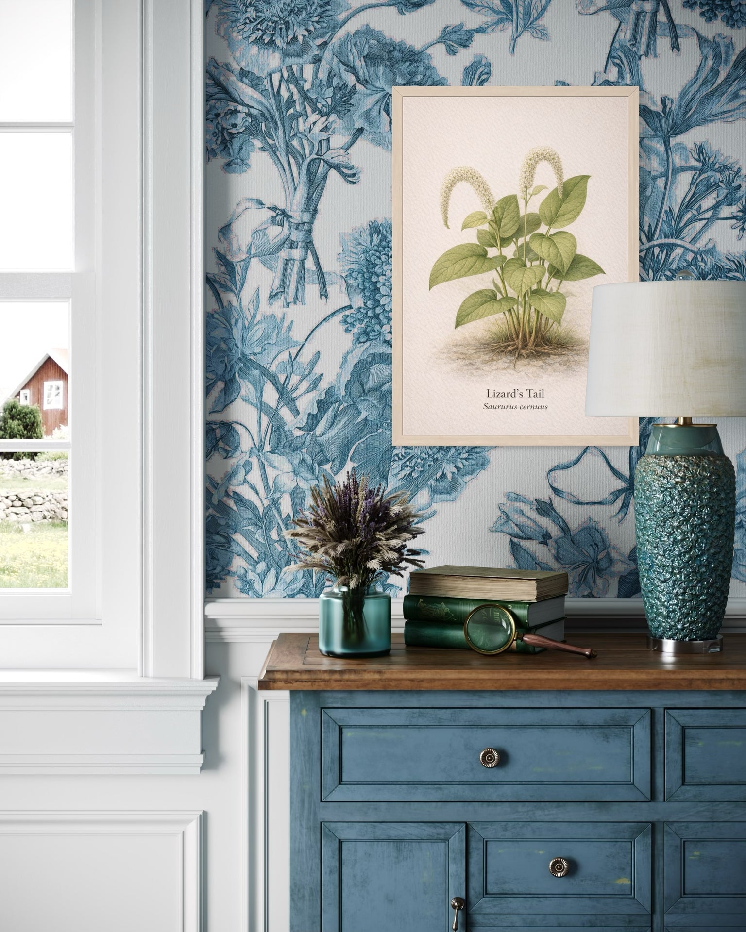 Room interior with blue floral wallpaper, a framed plant print, and decorative items on a wooden surface.